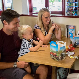 Family sat down at Cleethorpes Coast Light Railway