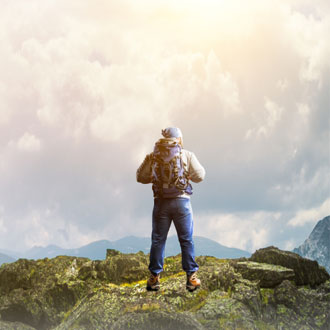 Man on top of a hill - Adventure Travel Show